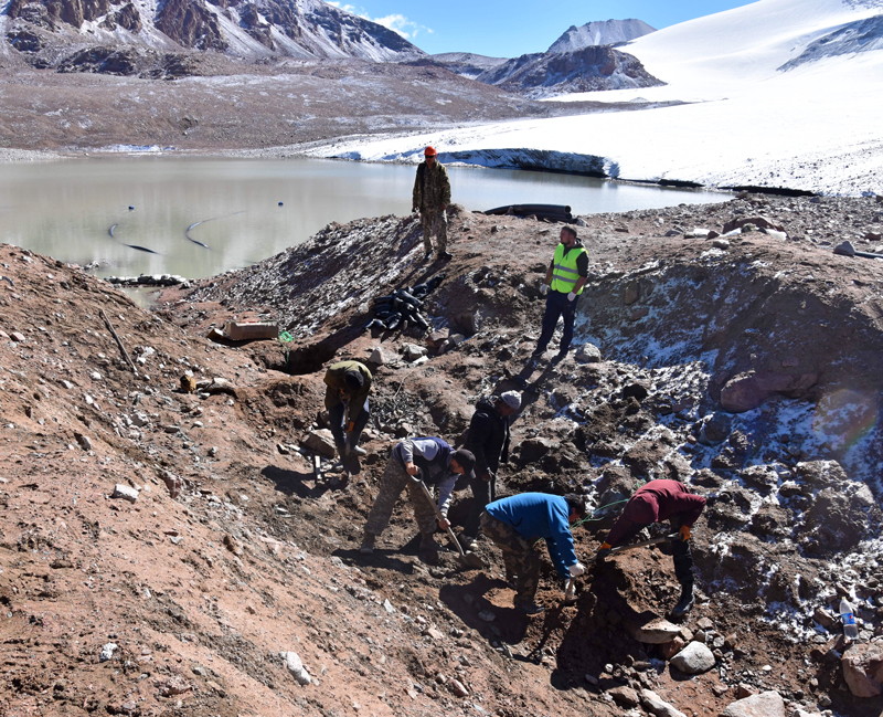 Specialists prepare explosives to deepen the runoff channel and lower the water level of a glacial lake at 3650 masl in the Ile Alatau mountains, Kazakhstan. Photo by Zhanar Raimbekova