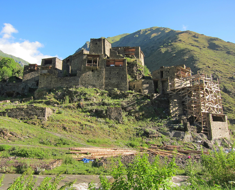 The Georgian village of Shatili in the Great Caucausus, near the border with Chechnya: a unique complex of medieval to early modern fortified dwellings, during restoration work in 2013. Photo by Marlène Thibault